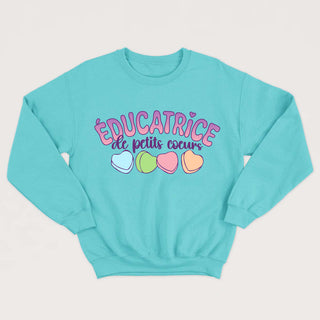 ÉDUCATRICE DE PETITS COEURS crewneck unisexe