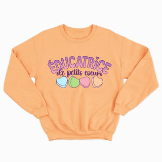 ÉDUCATRICE DE PETITS COEURS crewneck unisexe
